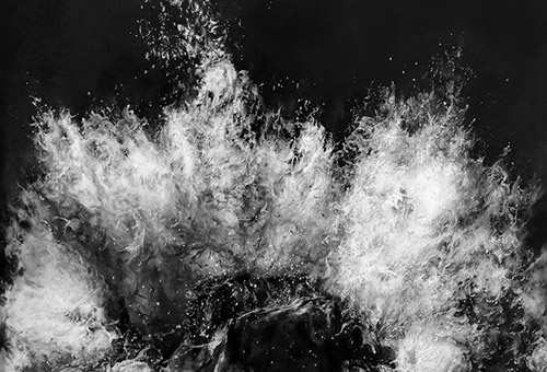 Black and white charcoal drawing of ocean waves